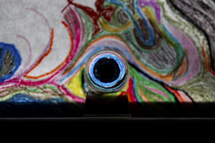 Marble eye against crayon image