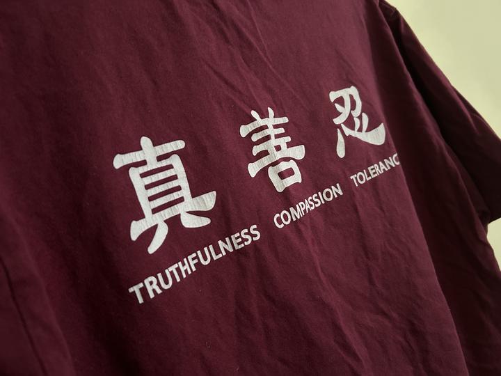 T-shirt with words truthfulness, compassion, tolerance in English and Mandarin